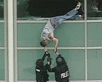 Columbine High School Library victim Patrick Ireland being pulled from library windows after the massacre