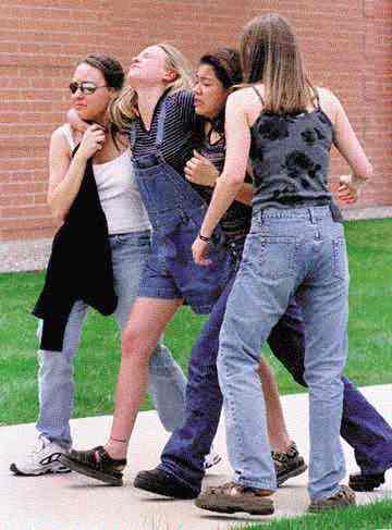 Students gather following the Columbine High School massacre, part of the photography for which the Denver Rocky Mountain News won the 2000 Breaking News Photography Pulitzer