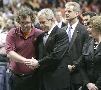 President George W. Bush shakes the hand of the Virginia Tech Student Government Association's President James Tyger following his speech at the school