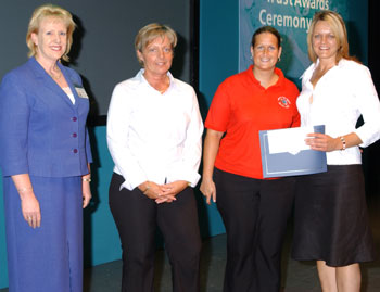 Health Tots and Rainbow Nursieries receiving their award from Monica Green
